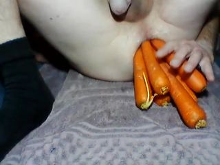 Latex Eddy Loves Inserting Carrots In His Arse NSFW