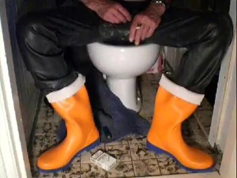 Lick nlboots - orange rubber boots and rubber trousers and toilet Tied - 1