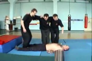 Tugjob Three martial artists trampling at dojo Bed